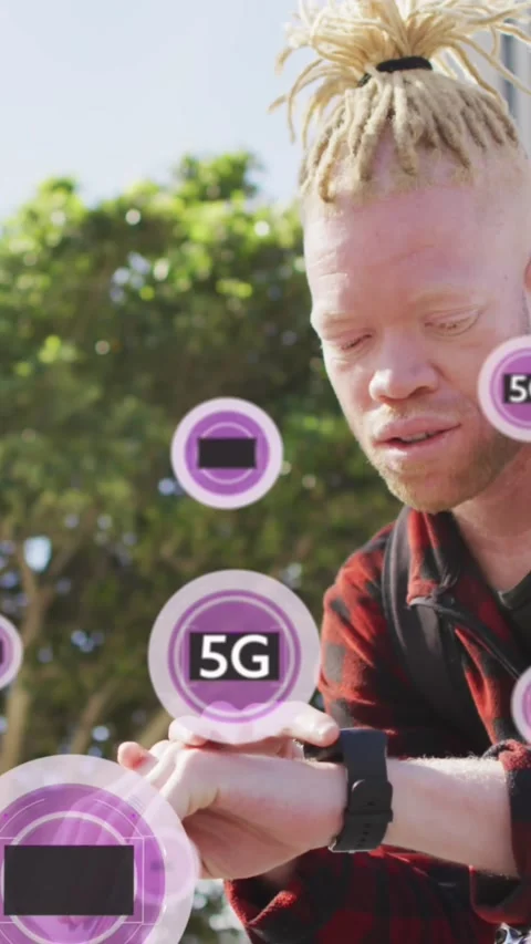 Animation of 5g texts over albino african american man scrolling on cellphone Stock Footage 320811688