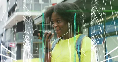 Animation of abstract pattern over african american woman talking on phone Stock Footage 327785262