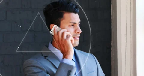 Animation of abstract triangular shape pulsating over businessman talking on Stock Footage 326625397