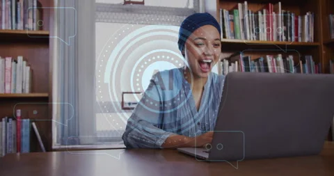 Animation of ai text and data over biracial female student in hijab with laptop 動画素材 265552002