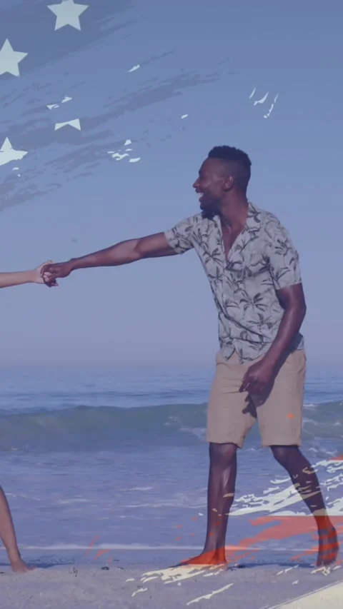 Animation of american flag design over african american couple enjoying at the Stock Footage 344774760