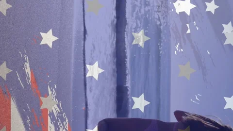 Animation of american flag elements over caucasian woman with surfboard running Stock Footage 312673028