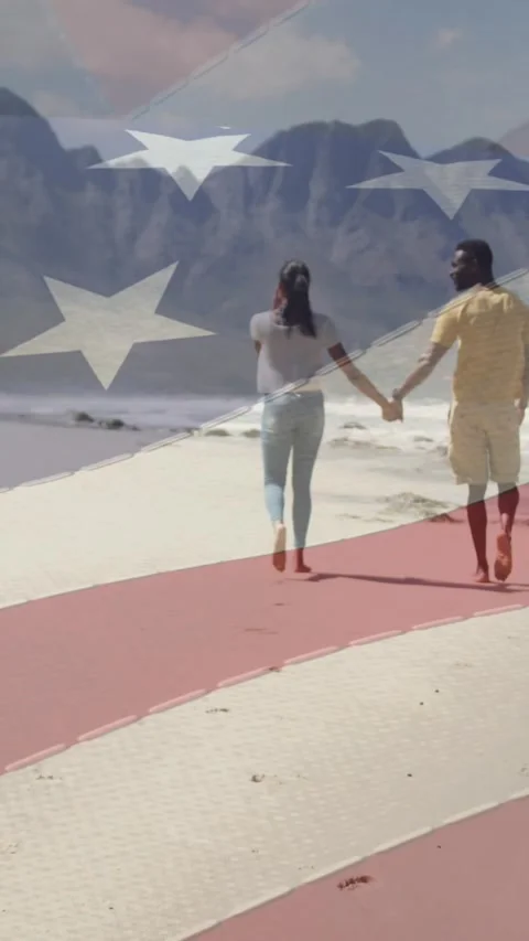 Animation of american flag moving over couple holding hands and walking on beach Vídeo Stock 342136314