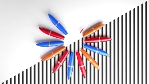 Animation of  appearance and rotation of colored tubes of mascara. Stock Footage 141711681