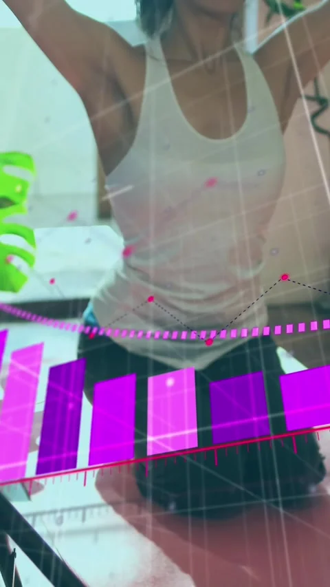 Animation of arrow on bar graph over woman teaching yoga online to student Stock Footage 344679272
