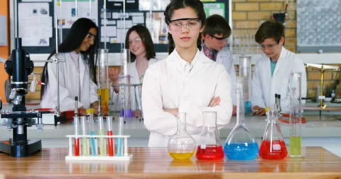Animation of back to school text over diverse students at science class Stock Footage 327644415