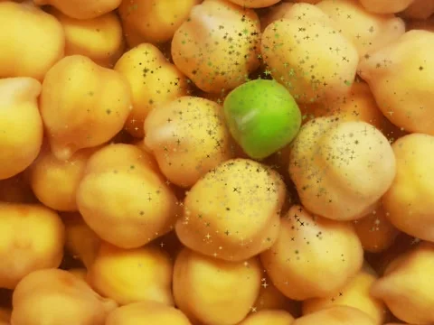 Animation with a background of chickpeas and a green pea in the middle. Stock Footage 170693920