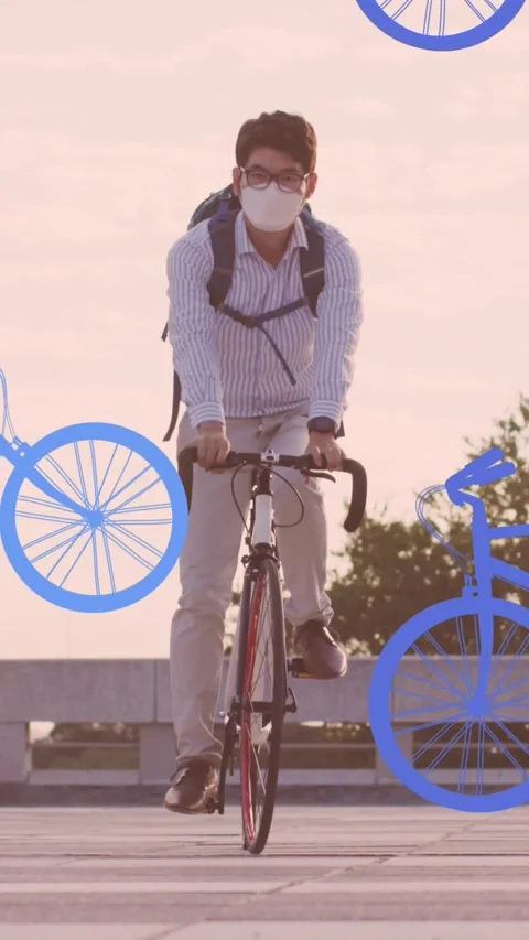 Animation of bicycles over boy wearing mask cycling Stockbeeldmateriaal 343545305