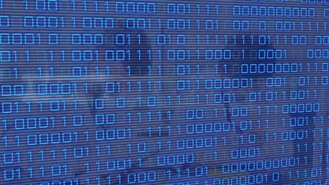 Animation of binary code and dna over blurred lab workers Stock Footage 328461383