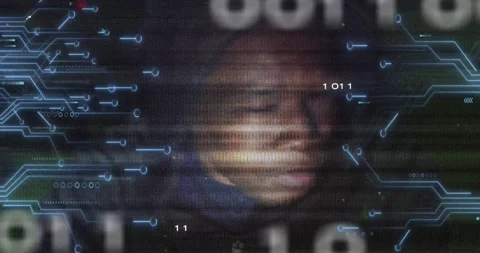 Animation of binary code, integrated circuit and face of african american hacker Video stock 203845907