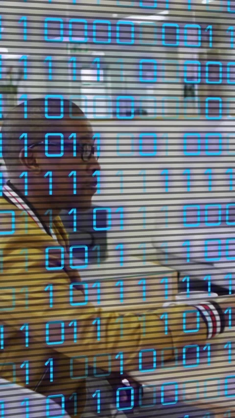 Animation of binary code over african american coworkers using laptop in office 스톡 동영상 341918521