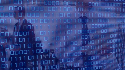 Animation of binary code over caucasian man and coworkers in office Stock Footage 328974111