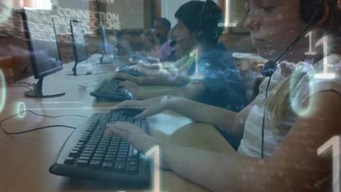 Animation of binary code over class of diverse pupils using computers Stock Footage 328641302