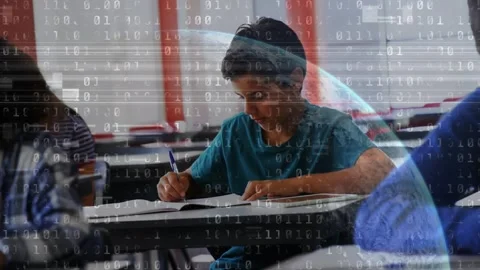 Animation of binary code over class of diverse pupils learning at school Stock Footage 330590712