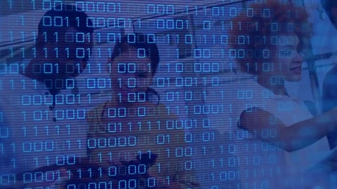 Animation of binary code over diverse female and male coworkers in office Stock Footage 327642434