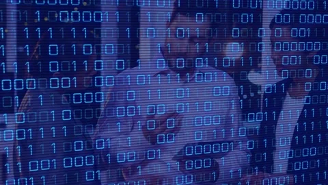 Animation of binary code over diverse female and male coworkers in office Stock Footage 330171451