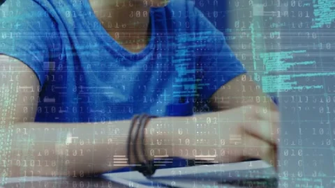 Animation of binary code over hands of caucasian boy using laptop Stock Footage 330724515