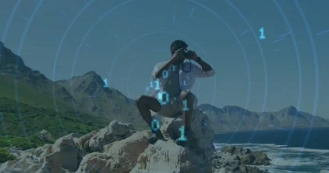Animation of binary codes, circles over african american man looking through Stock Footage 330256062
