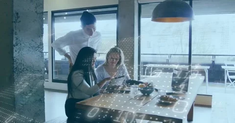 Animation of binary codes over diverse coworkers discussing reports on digital Stock Footage 328358146