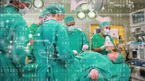 Animation of binary coding and data processing over diverse surgeons in Stock Footage 328353946