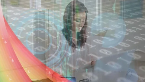 Animation of binary coding and pattern over woman paying online with credit card Stock Footage 327641545