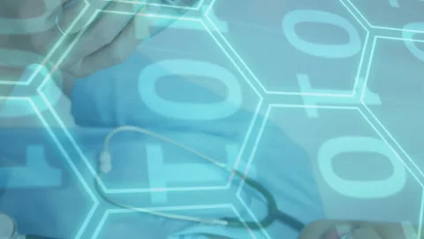 Animation of binary coding data processing over diverse female doctor and male Stock Footage 312727597