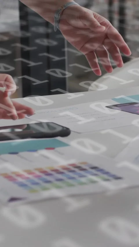 Animation of binary coding data processing over diverse business people in Stock-Footage 343079314
