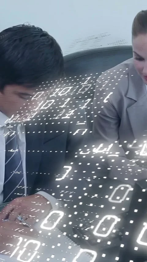 Animation of binary coding data processing over diverse business people in Stock-Footage 343548201
