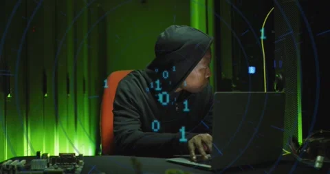 Animation of binary coding over african american male hacker with computer and Stock Footage 330722573