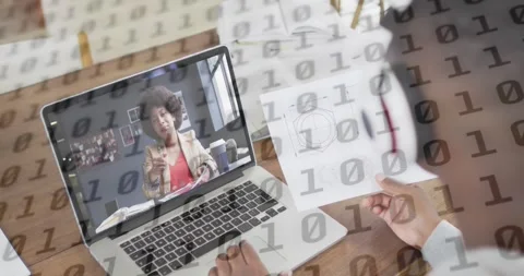 Animation of binary coding over caucasian man with documents having laptop video Stock Footage 328633625