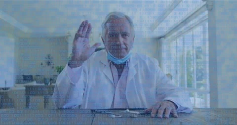 Animation of binary coding over caucasian senior doctor talking on videocall at Stock-Footage 330254776