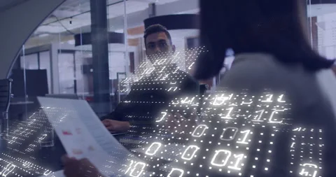 Animation of binary coding over diverse business people working together in Stock Footage 307894111