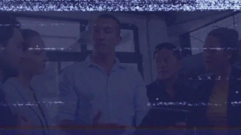 Animation of binary coding over diverse football players on beach Stock Footage 325836648