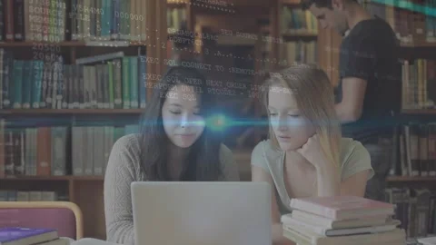 Animation of blue diverse students using computers in school classroom Stock Footage 330661822