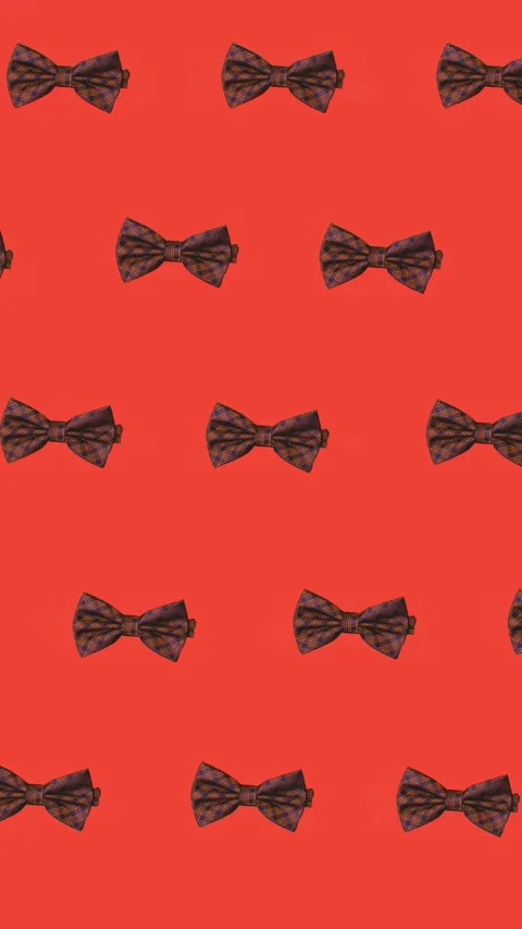 Animation of bow ties floating over red background Stock Footage 320034875