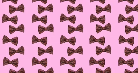 Animation of bow ties floating over pink background Stock Footage 328505096