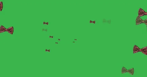 Animation of bow ties floating over green background Stock Footage 329104897