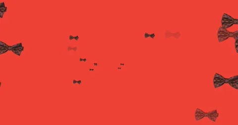 Animation of bow ties floating over red background Stock Footage 329220380