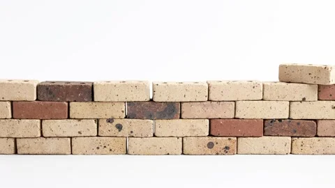 Animation of brown bricks stacking up on a white background Stock Footage 229804639