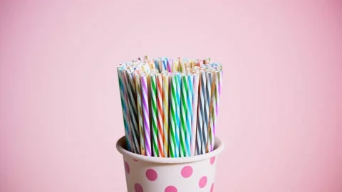 Animation of a bunch of drinking straws in the cup. Zooming in colourful straws. Stock Footage 133471662
