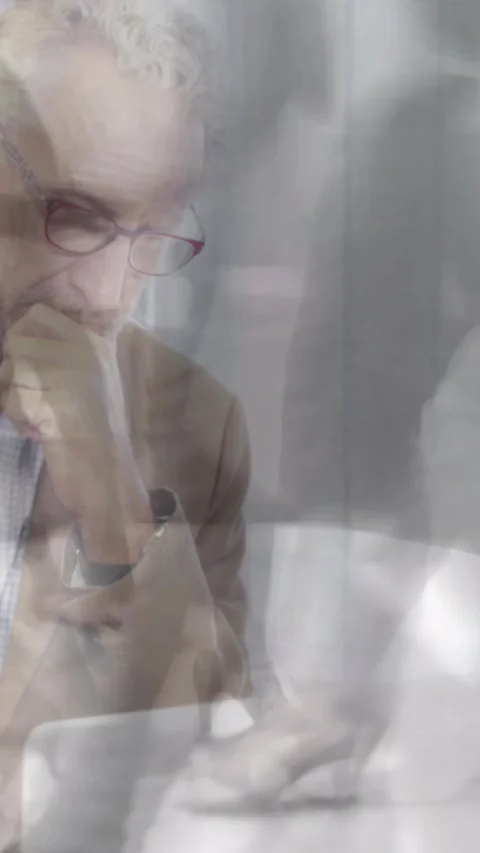 Animation of businessman using laptop over sped up commuters walking in building Stock Footage 344693434