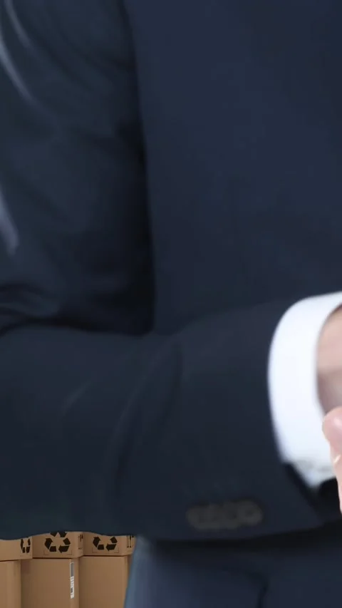 Animation of businessman using smartphone with stacks of boxes on white Stock Footage 331652984