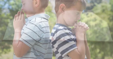 Animation of caucasian boys praying and holy bible Stock Footage