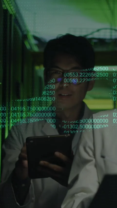 Animation of chain and data processing over diverse it engineers by computer Stock Footage 342676187