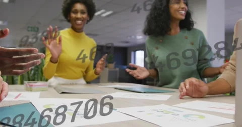 Animation of changing numbers against diverse colleagues stacking their hands Stock Footage 329223374