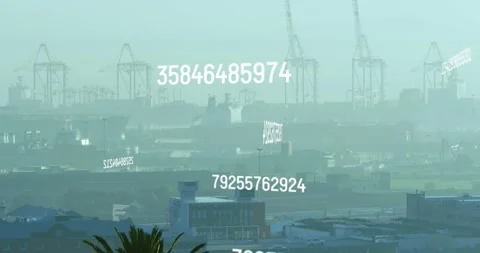 Animation of changing numbers and computer language over fog covered modern city Stock Footage 329924320