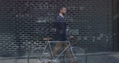 Animation of changing numbers and symbols over caucasian man with bicycle Stock Footage 327200322