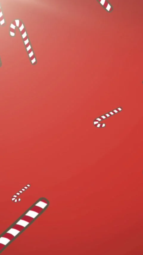 Animation of christmas candy canes decorations falling with glowing light on red Stock Footage 319514170