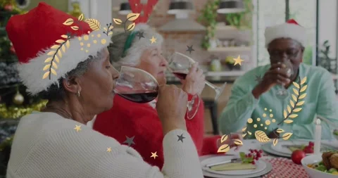 Animation of christmas pattern over senior diverse friends in santa hats at Stock Footage 329964904
