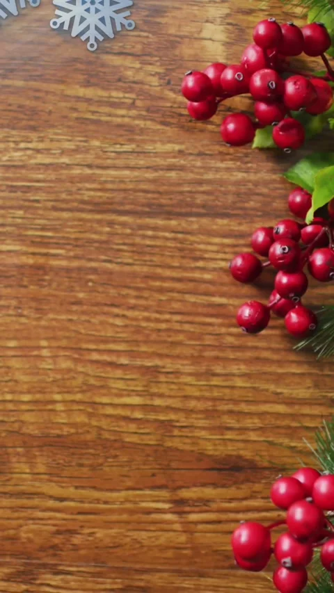 Animation of christmas snowflake pattern over christmas decorations Stock Footage 344594211